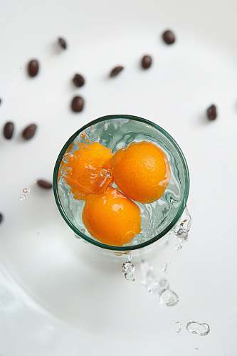 fruit orange fruit in clear glass bowl plant